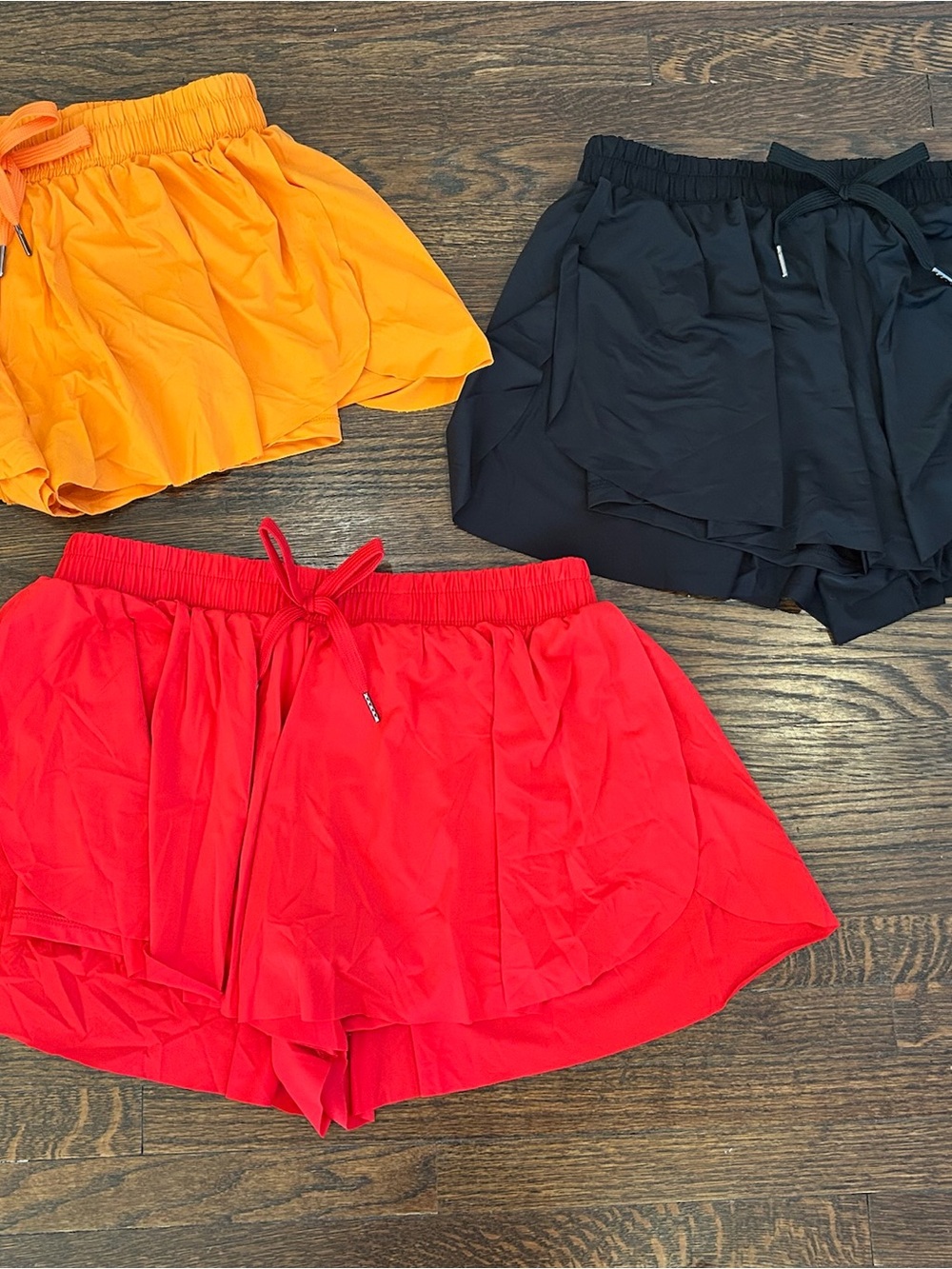 GB girls Three-Pack Active Skorts in Red, Orange, Black
